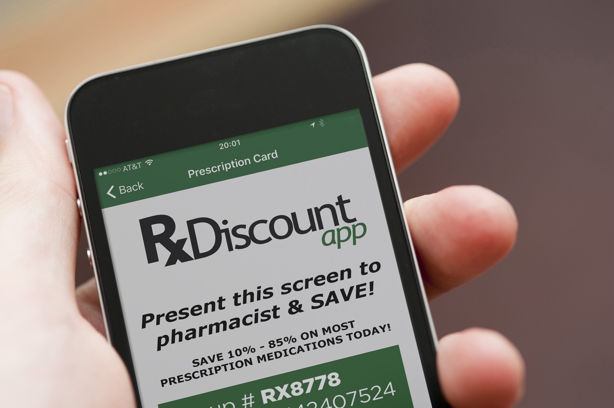 Close-up of a hand holding a smart mobile black phone, cut out